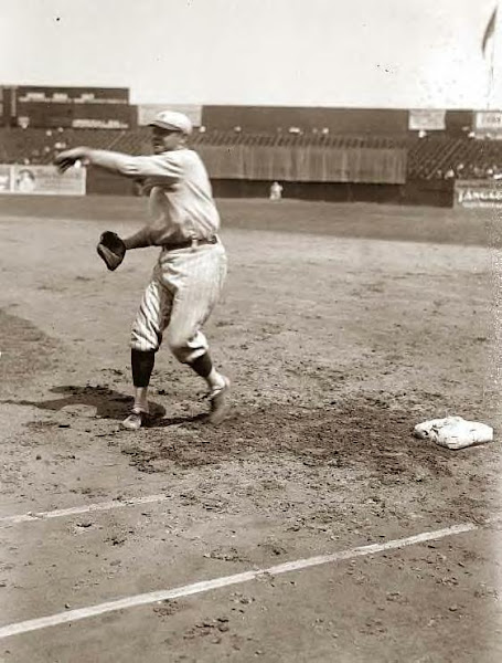 Babe Ruth pitching on field