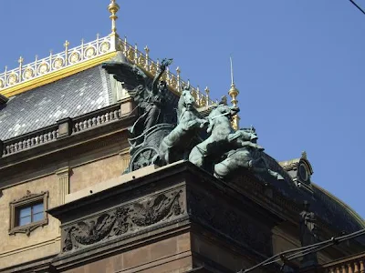 chariot with horses statue on roof in Prague