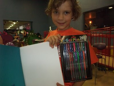 The Birthday Boy with drawing pad and pens