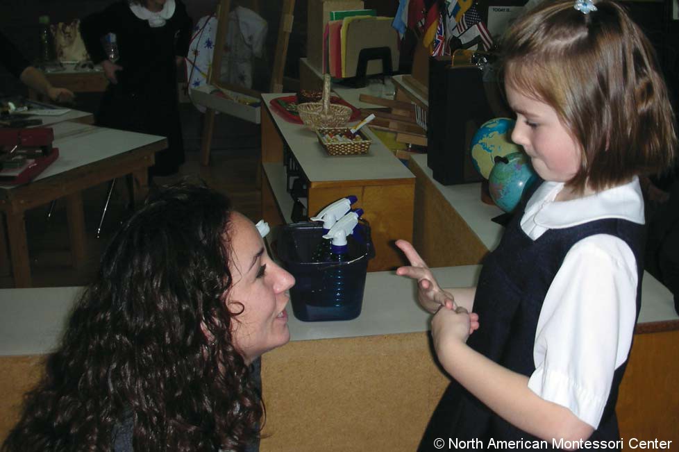 Gluing Redirecting Behavior NAMC Montessori Classroom Working Towards Normalization teacher girl