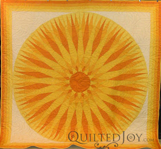 Sunshine Compass Quilt with Flame Curl Pantograph. Edge to edge quilting by Angela Huffman - QuiltedJoy.com