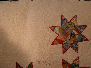 Scrappy Stars Quilt with custom quilting by Angela Huffman - QuiltedJoy.com