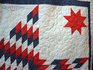Patriotic Lone Star Quilt with stars and loops edge to edge quilting - QuiltedJoy.com