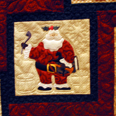 Eve's Santa Applique quilt with custom quilting by Angela Huffman - QuiltedJoy.com