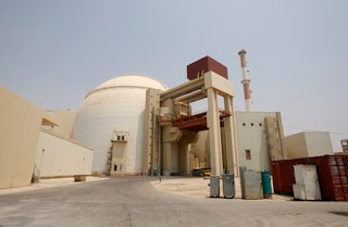 iran starts a reactor, while israel has 'hundreds of nuclear bombs'