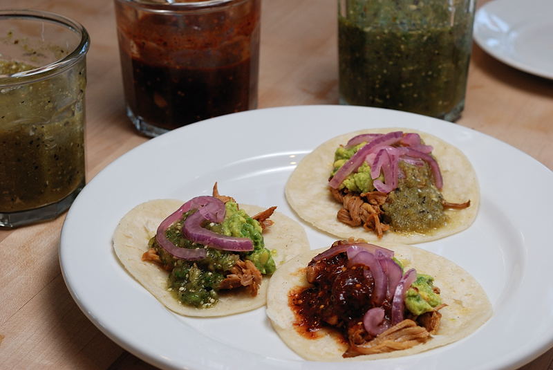 Grilled achiote pork tacos with cilantro, onions, and salsa