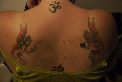 Two Fairies Tattoo at the upper back