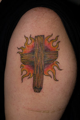 Flaming Cross Tattoo at the Shoulder