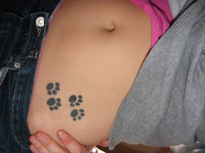 girls side tattoos with paw print tattoos designs