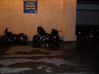 Motorcycles park in front of the doors