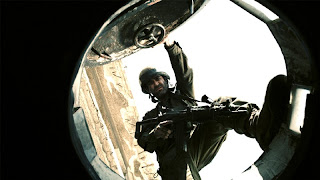Still image of Gamil about to get into a tank from the film Lebanon (2009)