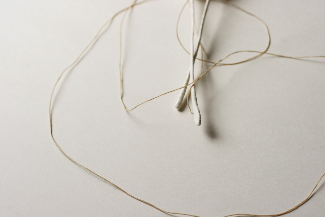A Love Story, 2008. waxed thread through paper over wire. 22.5 x 3 cm together