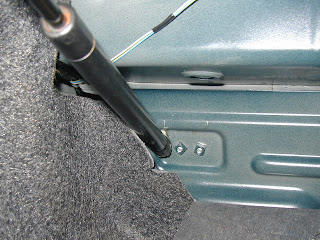 …and then bolts into rear either side of the seats.