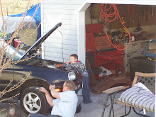Dillon helping grandpa fix Uncle Brian's car