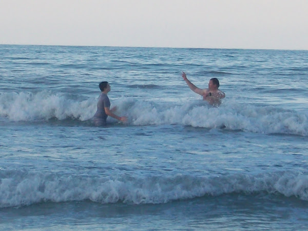 Dad and Joseph playing in the waves