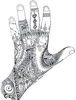 outline of hand filled in with doodles