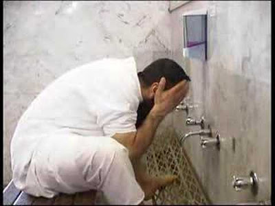 0 A Muslim man preparing for Namaz in Mosque