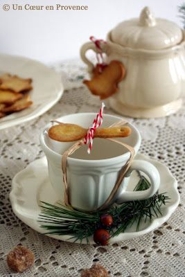 Teacup decorated with a spoon-shaped shortbread cookies for a festive time