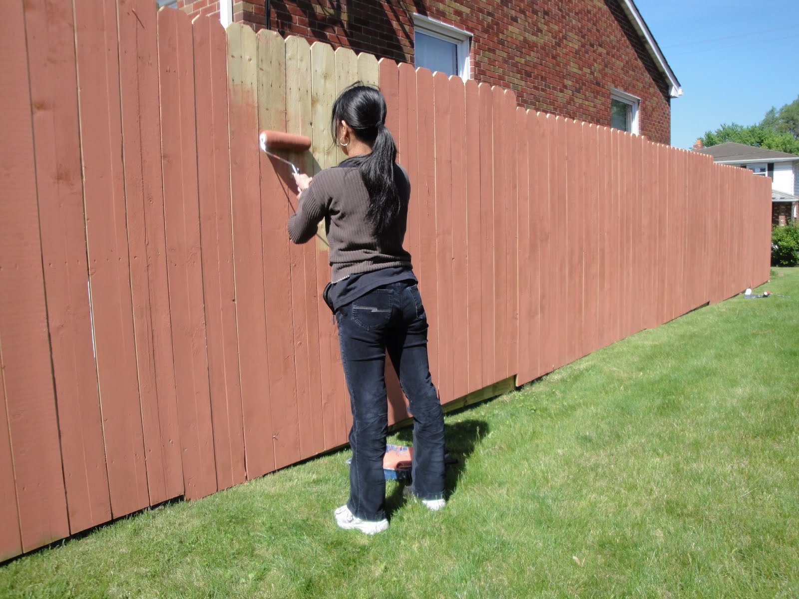 Travels and Wandering Painting the Fence.. a family thing.