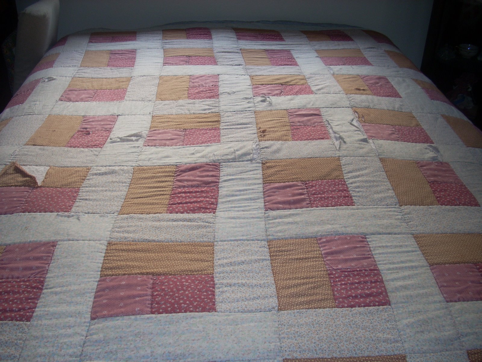 Old worn log cabin quilt