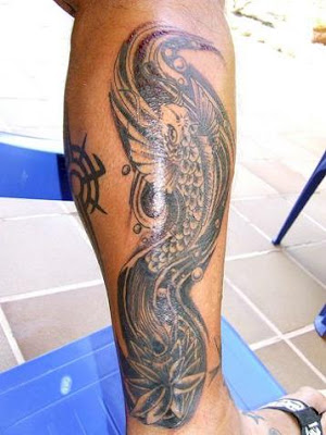 Artistic Japanese black koi fish tattoo on leg.