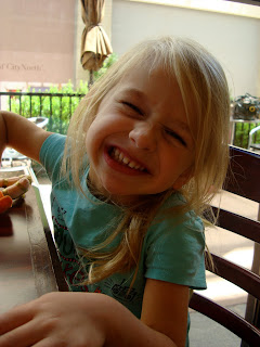 Child sitting at table smiling