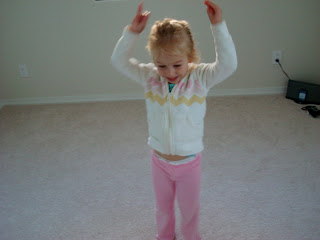 Young girl in room dancing