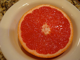 Half of a grapefruit in dish