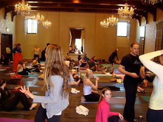 Room full of people on yoga mats