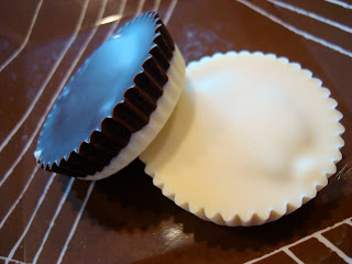 Close up of Vegan White Chocolate Chocolate-Peanut Butter Cup and half and half Peanut Butter Cup on Plate