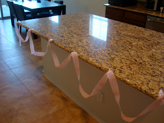 Countertop decorated with pink streamer