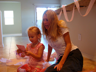 Woman and child looking at birthday card