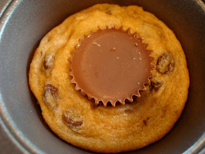 Close up of one Peanut Butter Cup Chocolate Chip Cookie in muffin tin