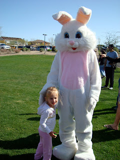 Young girl standing with next to the Easter bunny