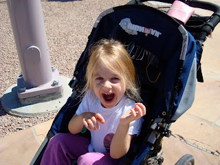 Young girl in stroller smiling