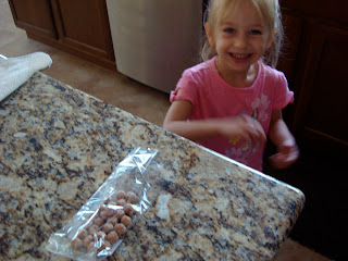 Young girl reaching for cinnamon sugar coated pretzels on countertop