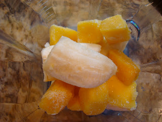 Overhead of ingredients for Mango BananaVanilla Softserve in blender