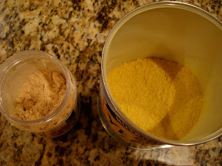 Overhead of open powdered peanut butter and nutritional yeast containers