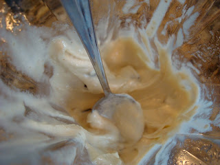 Spoon stirring up Vegan Mint Chocolate Chip Softserve