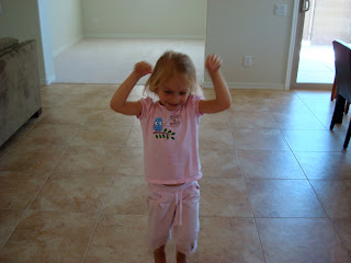 Young girl in pink shirt dancing