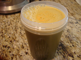Shaker cup filled with fresh juiced vegetables and fruit