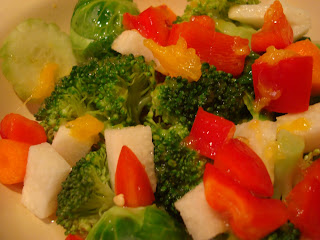 Chopped vegetables mixed together in clear container
