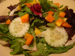 Mixed vegetable and green salad in shallow white bowl