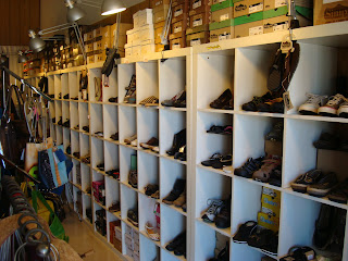 Stacked shoes in cubbies inside Vegan store