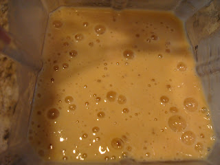 Inside blender after bananas, cinnamon, almond milk and protein powder were blended