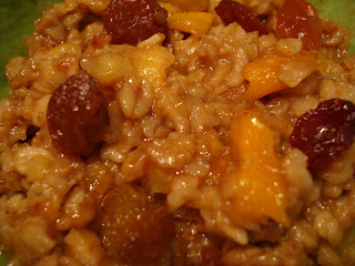 Raw oatmeal after heated topped with golden raisins and mango
