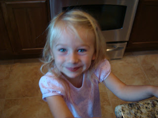 Young Girl smiling in kitchen