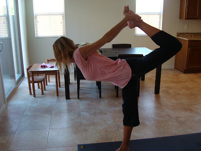 Woman doing Natarajasana yoga pose