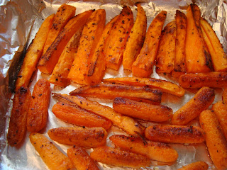 Roasted Sweet Potatoes and Carrots in foil lined pan out of oven