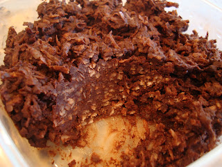 Raw Vegan Chocolate Coconut Snowball  mixture in container with portion taken out